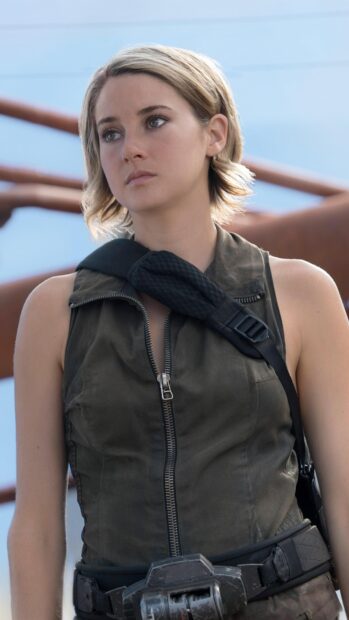 A focused woman stands ready for action in Allegiant wallpapers, 4K Phone Wallpaper