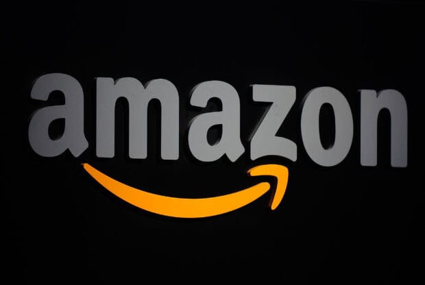 The Amazon brand logo with a yellow smile arrow on a black background, 2K Desktop Wallpaper