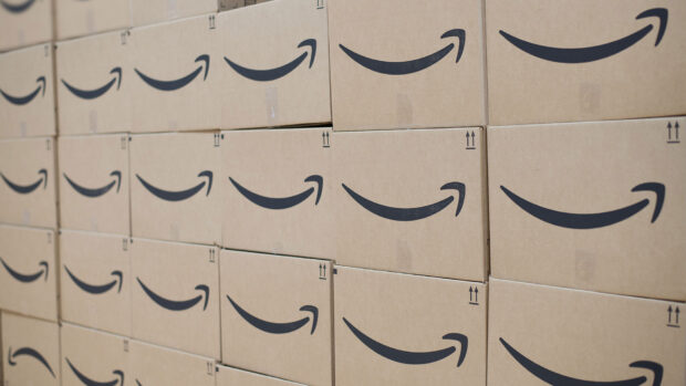A large stack of Amazon boxes is neatly arranged on pallets ready for delivery, HD Desktop Wallpaper
