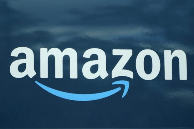 The Amazon logo shows the brand name with a curved arrow underneath, 2K Desktop Wallpaper
