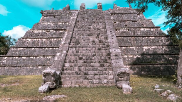 An ancient pyramid at Chichen Itza stands under a clear blue sky, 2K Desktop Wallpaper