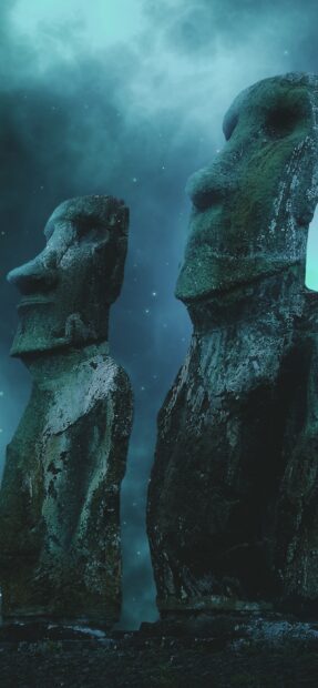 Two ancient statues from Easter Island stand under a starry night sky, 2K Phone Wallpaper