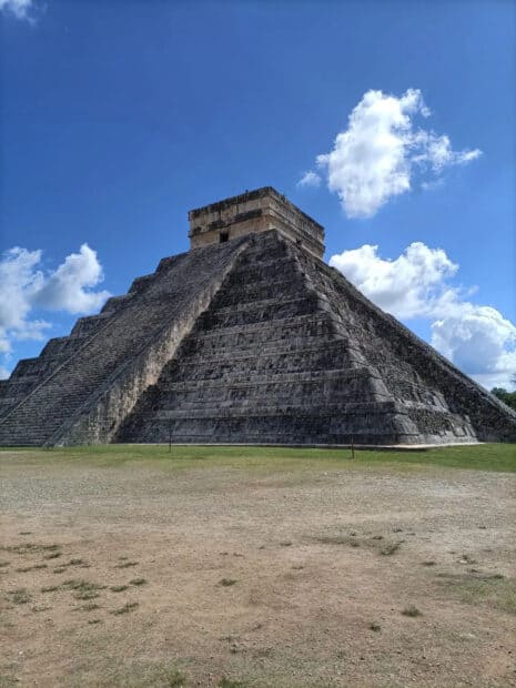 The ancient Mayan pyramid stands tall under a clear blue sky at Chichen Itza, HD Mobile Wallpaper