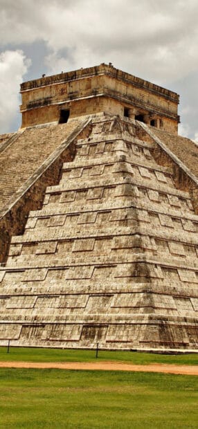The ancient Mayan pyramid at Chichen Itza stands tall under cloudy skies, HD Phone Wallpaper
