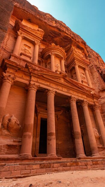 The Petra Jordan site displays a carved sandstone facade with intricate columns and details, HD Mobile Wallpaper
