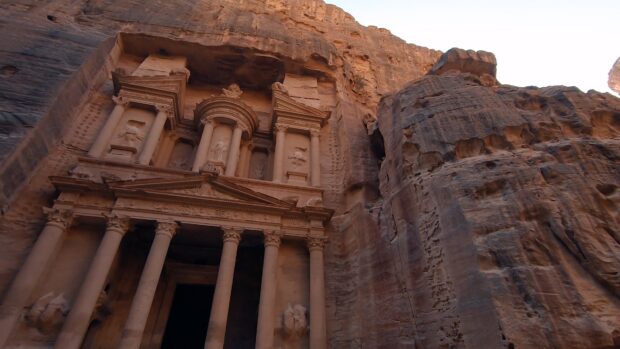 The ancient stone structure of Petra in Jordan stands carved into the cliff, 4K Desktop Wallpaper