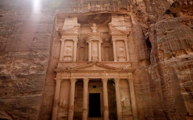 The ancient Treasury in Petra Jordan stands carved into the rock with impressive details, 2K Desktop Wallpaper