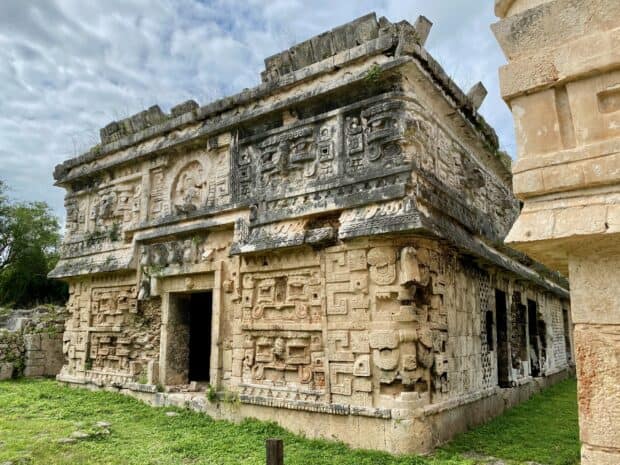 The ancient building at Chichen Itza features detailed Mayan carvings on stone walls, 2K Desktop Wallpaper