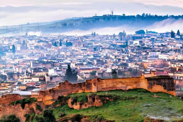 A view of the ancient city walls with buildings and hills in Morocco, HD Desktop Wallpaper