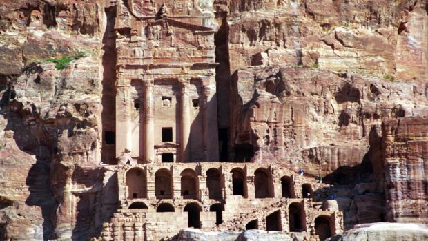 The ancient rock cut city of Petra Jordan showcases intricate carvings in sandstone cliffs, Petra Jordan Wallpapers, 2K Desktop Wallpaper