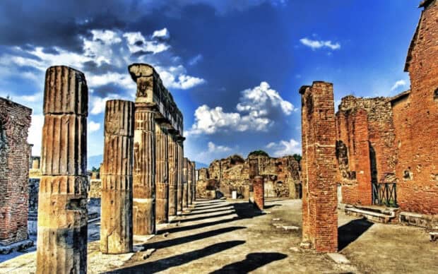 The ancient stone columns and brick walls stand under a bright blue sky in Pompeii, HD Desktop Wallpaper