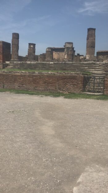The Pompeii ruins show ancient columns under a blue sky in the historic site, HD Phone Wallpaper