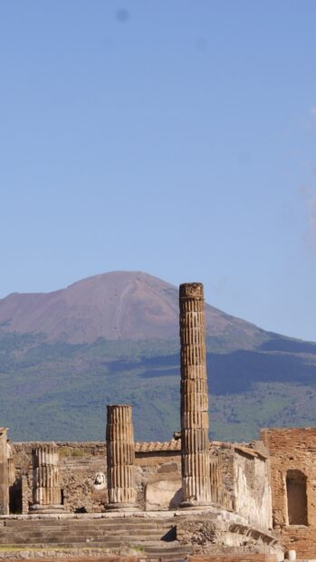 The ancient ruins of Pompeii stand with Mount Vesuvius in the background in this Pompeii Wallpapers image, HD Mobile Wallpaper