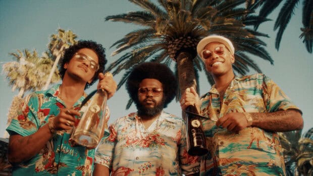 Anderson Paak poses with friends outdoors wearing vibrant shirts and sunglasses, HD Desktop Wallpaper