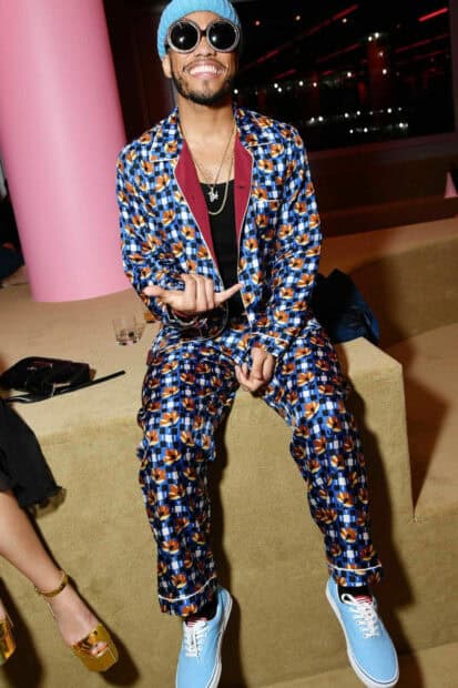 Anderson Paak is sitting and smiling wearing a blue patterned suit and sunglasses, HD Mobile Wallpaper