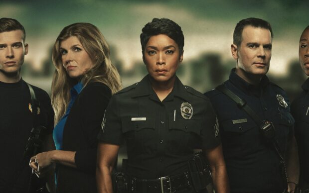 Angela Bassett and fellow officers stand united in intense portrait, 2K Desktop Wallpaper