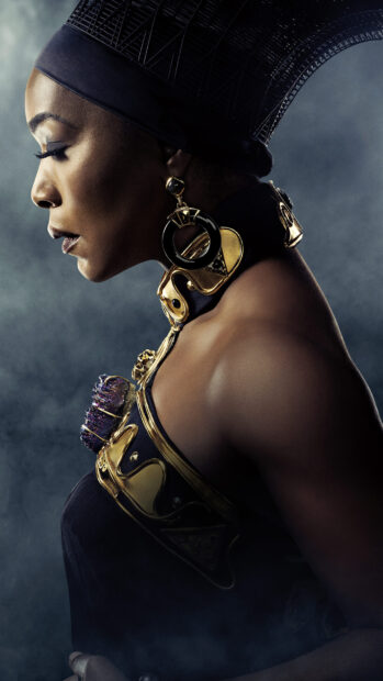 Angela Bassett wears gold accessories and a hat in a side profile, 2K Phone Wallpaper