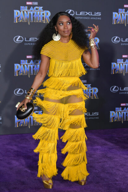 Angela Bassett wears a bright yellow fringed gown while posing confidently at the Black Panther premiere, HD Desktop Wallpaper