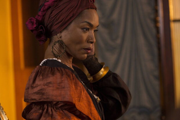 Angela Bassett wears a detailed headscarf and earrings in a historical setting, HD Desktop Wallpaper