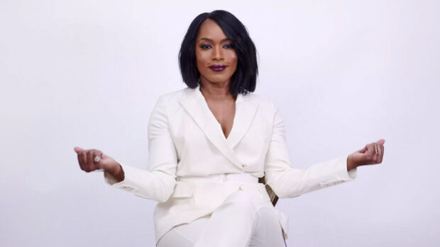 Angela Bassett in a white suit sitting with arms extended, HD Desktop Wallpaper