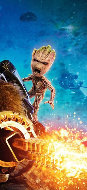 Groot shows an intense expression while firing a weapon in space, HD Phone Wallpaper