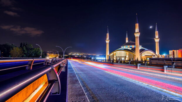 The night view of Ankara captures a mosque illuminated near a busy road under a crescent moon, HD Desktop Wallpaper