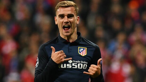 Antoine Griezmann shows a celebratory gesture while wearing the Atletico Madrid jersey, HD Desktop Wallpaper