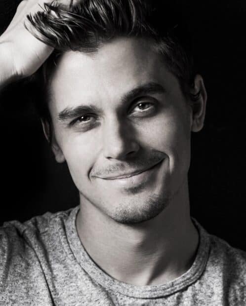 A close up black and white portrait of Antoni Porowski smiling gently, HD Mobile Wallpaper