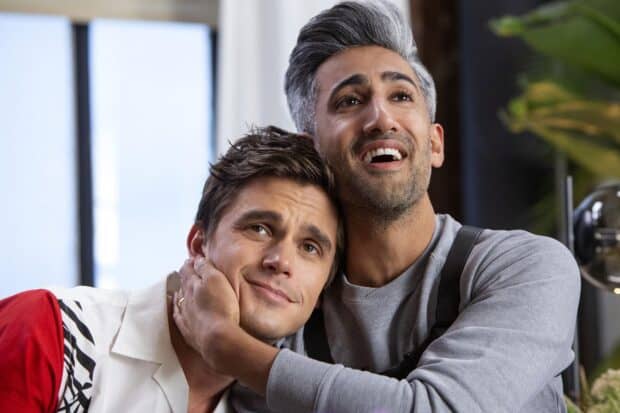 Antoni Porowski shares a happy moment with a friend in a bright room, HD Desktop Wallpaper