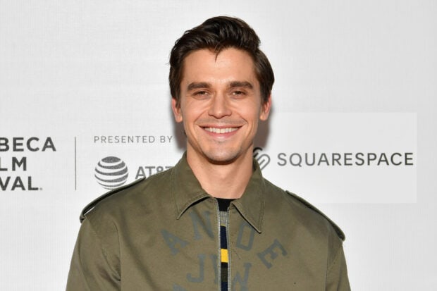 Antoni Porowski wallpapers featuring a smiling man in a green jacket, HD Desktop Wallpaper