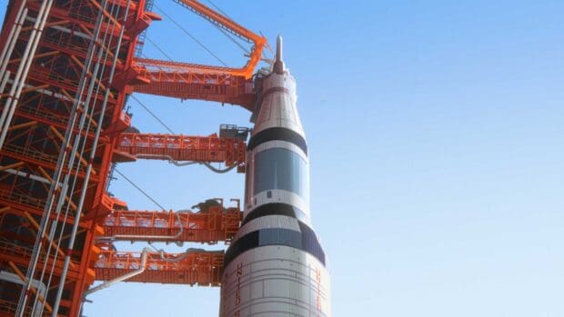 The Apollo 10 rocket stands ready on the launch pad under a clear blue sky, HD Desktop Wallpaper
