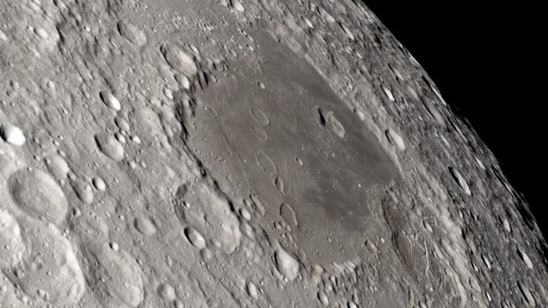 A detailed view of the Apollo 13 lunar surface showing craters and moon terrain, 2K Desktop Wallpaper