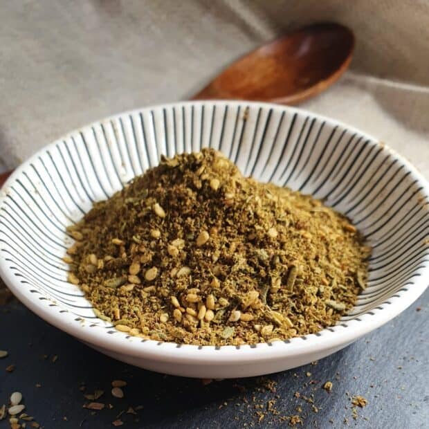 A close up of seasoning with herbs and spices in a bowl on a table, HD Mobile Wallpaper