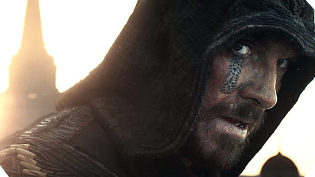 A close up of a hooded character with distinctive face markings from Assassins Creed movie, HD Desktop Wallpaper