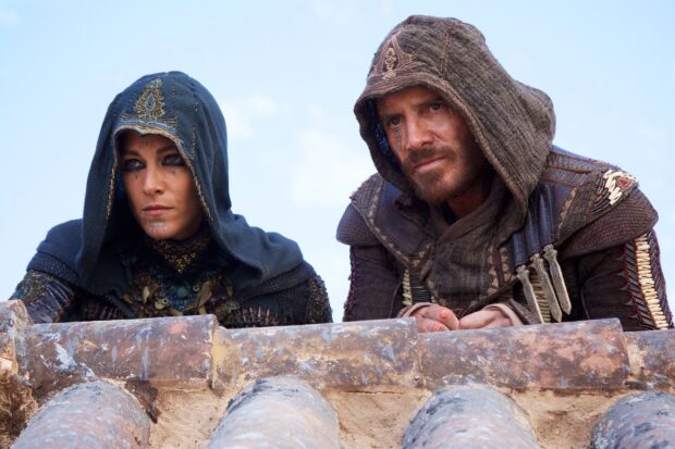 Two characters from Assassins Creed movie wear detailed hooded costumes, HD Desktop Wallpaper