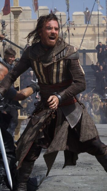 A fierce warrior is engaged in a chaotic battle in this Assassins Creed Movie scene, HD Phone Wallpaper