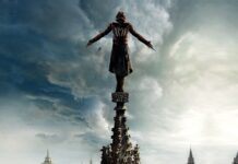 A figure in an Assassin outfit stands on a high spire under a dramatic cloudy sky, 4K Desktop Wallpaper