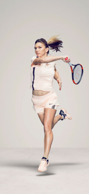 A female tennis player hitting a forehand shot during a match, HD Phone Wallpaper