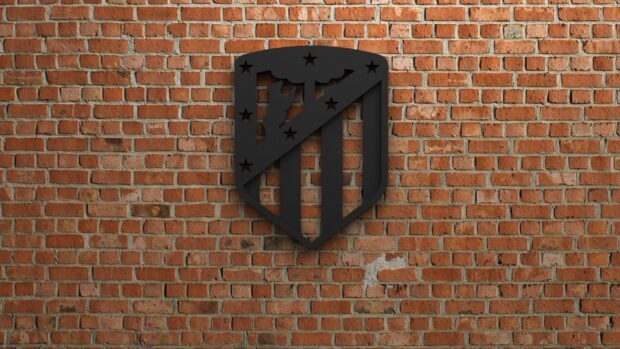 The Atletico Madrid emblem is displayed in a black design on a brick wall, HD Desktop Wallpaper