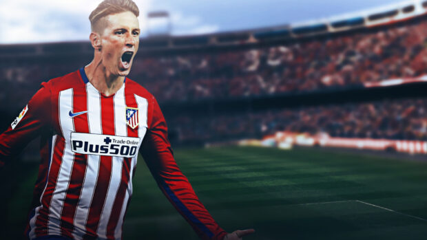 A soccer player wearing an Atletico Madrid jersey celebrates passionately on the field, HD Desktop Wallpaper