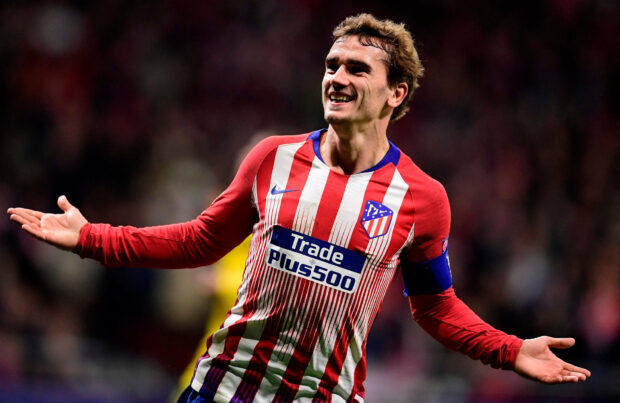A smiling Atletico Madrid player is celebrating during a match, HD Desktop Wallpaper