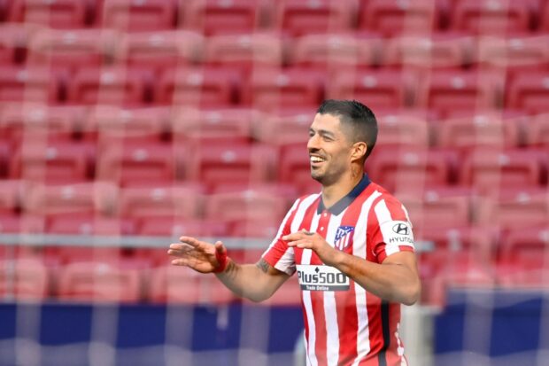 A smiling Atletico Madrid player is celebrating a goal during the match, HD Desktop Wallpaper