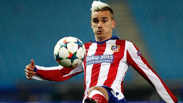 A soccer player from Atletico Madrid focuses on the ball during a match, HD Desktop Wallpaper