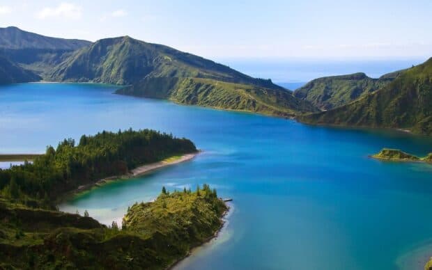 The Azores Wallpapers show a serene blue lake surrounded by green volcanic hills, HD Desktop Wallpaper