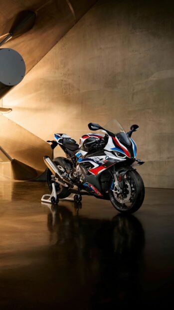 A BMW M 1000 RR motorcycle is showcased in a sleek indoor setting, HD Phone Wallpaper