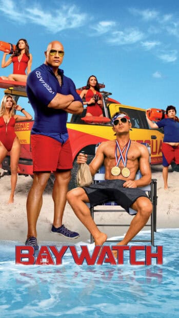 The Baywatch movie cast stands confidently on the beach in lifeguard attire near rescue equipment, HD Mobile Wallpaper