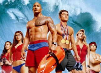 The Baywatch movie characters stand ready with ocean waves in the background, 2K Desktop Wallpaper