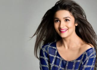 A smiling Bollywood star wearing a blue dress with long flowing hair, HD Desktop Wallpaper