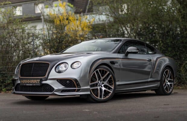 A sleek Bentley Continental GT sports car is shown in a stylish gray color with orange accents, HD Desktop Wallpaper