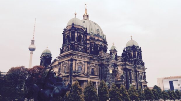 The Berlin Cathedral stands tall with historic features and a statue in front, HD Desktop Wallpaper